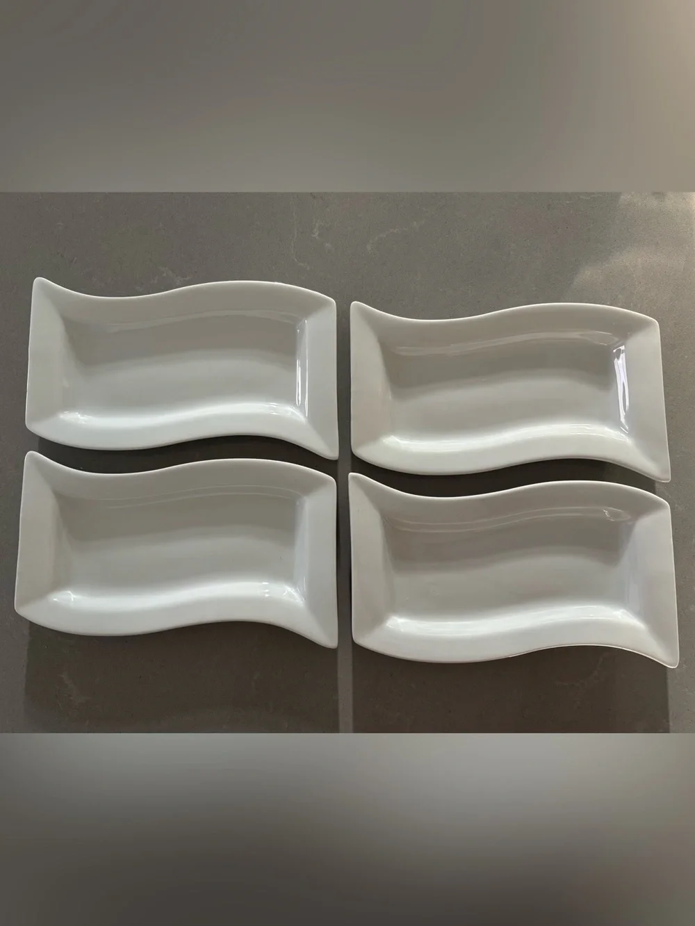 set of 4 Pier 1 Wavy white porcelain serving dishes
